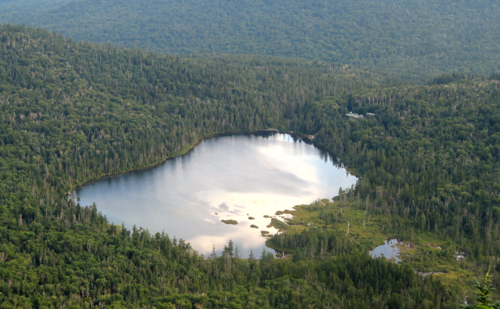 Lonesome Lake from above. With the behind-the-lake trail in view. 