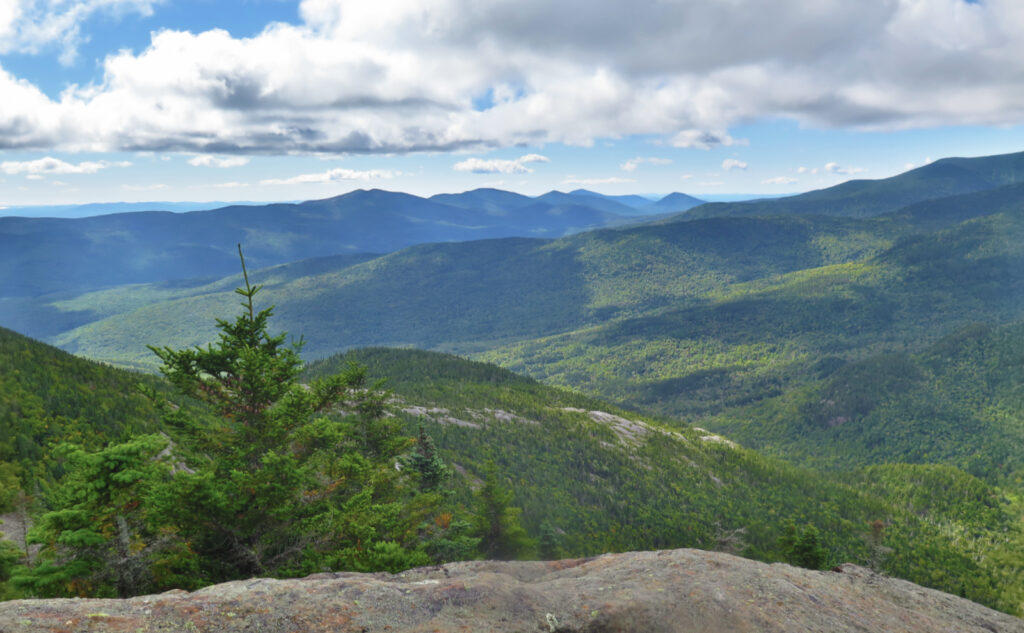 View of Baldface Mountains and the Wild River Wilderness from the ledges of Mt Moriah. 