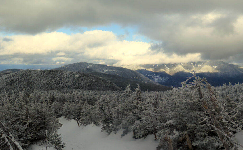 View from Kinsman Ridge Trail, across to a cloudy Franconia Ridge.