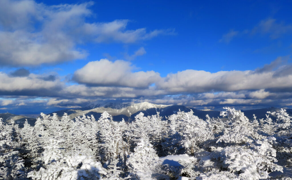 Franconia Ridge partially blocked by clouds, as seen from South Kinsman Mountain, NH. 