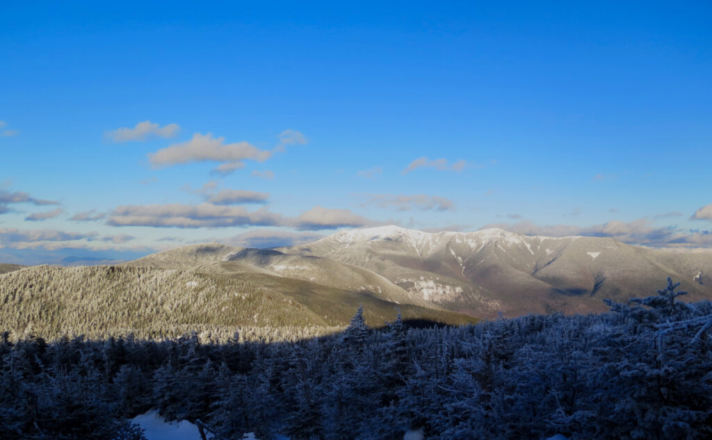 Mostly clear view of Franconia Ridge, from North Kinsman Mountain, NH. Cannon Mountain nearby. 