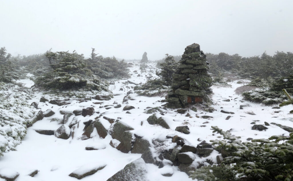 Cairns in the fog, near the summit. Mt Moosilauke, Benton, NH. 2 May, 2023. 