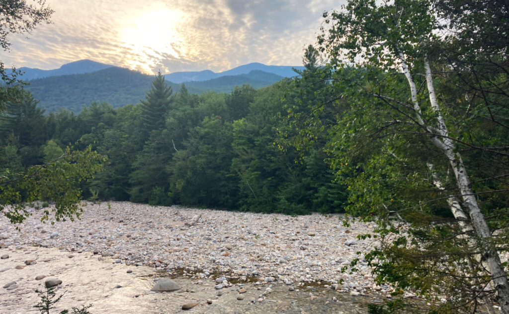 Sunset over east branch of the Pemigewasset River, Mt Flume in the distance. Pemigewasset Wilderness, east side, White Mountains, New Hampshire. 